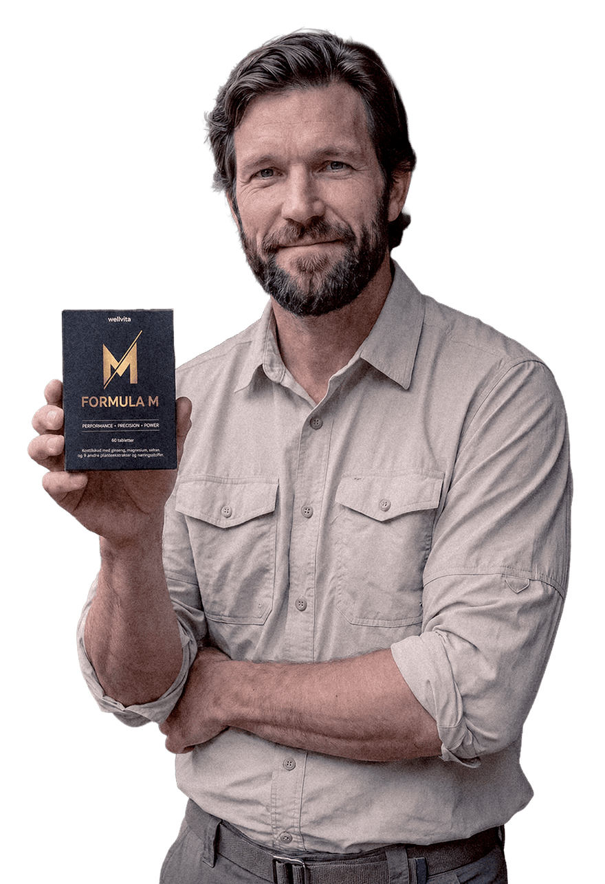 A man with a beard and short hair, wearing a light beige button-up shirt, holds up a black product box with gold lettering that reads 'FORMULA M' against a solid white background.
