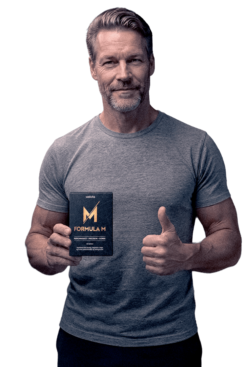 A man in a gray t-shirt holding a black box of MEGA Formula H, giving a thumbs-up against a solid white background.